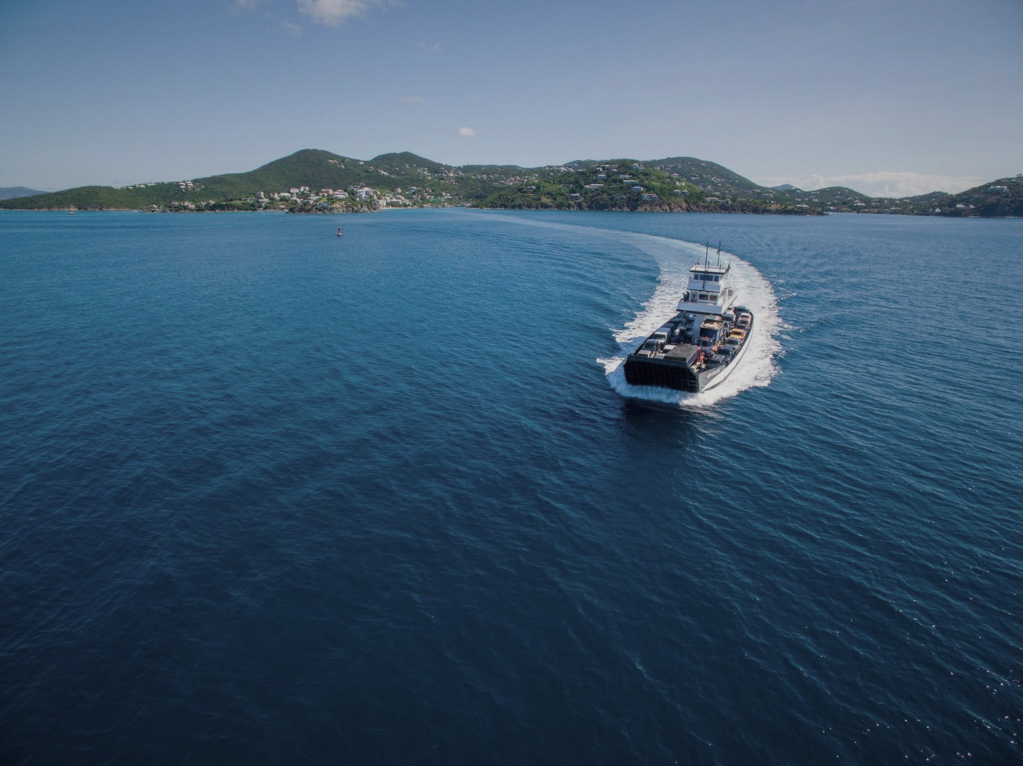 Car and passenger ferry crossing the channel between St. Thomas and St. John, aerial view