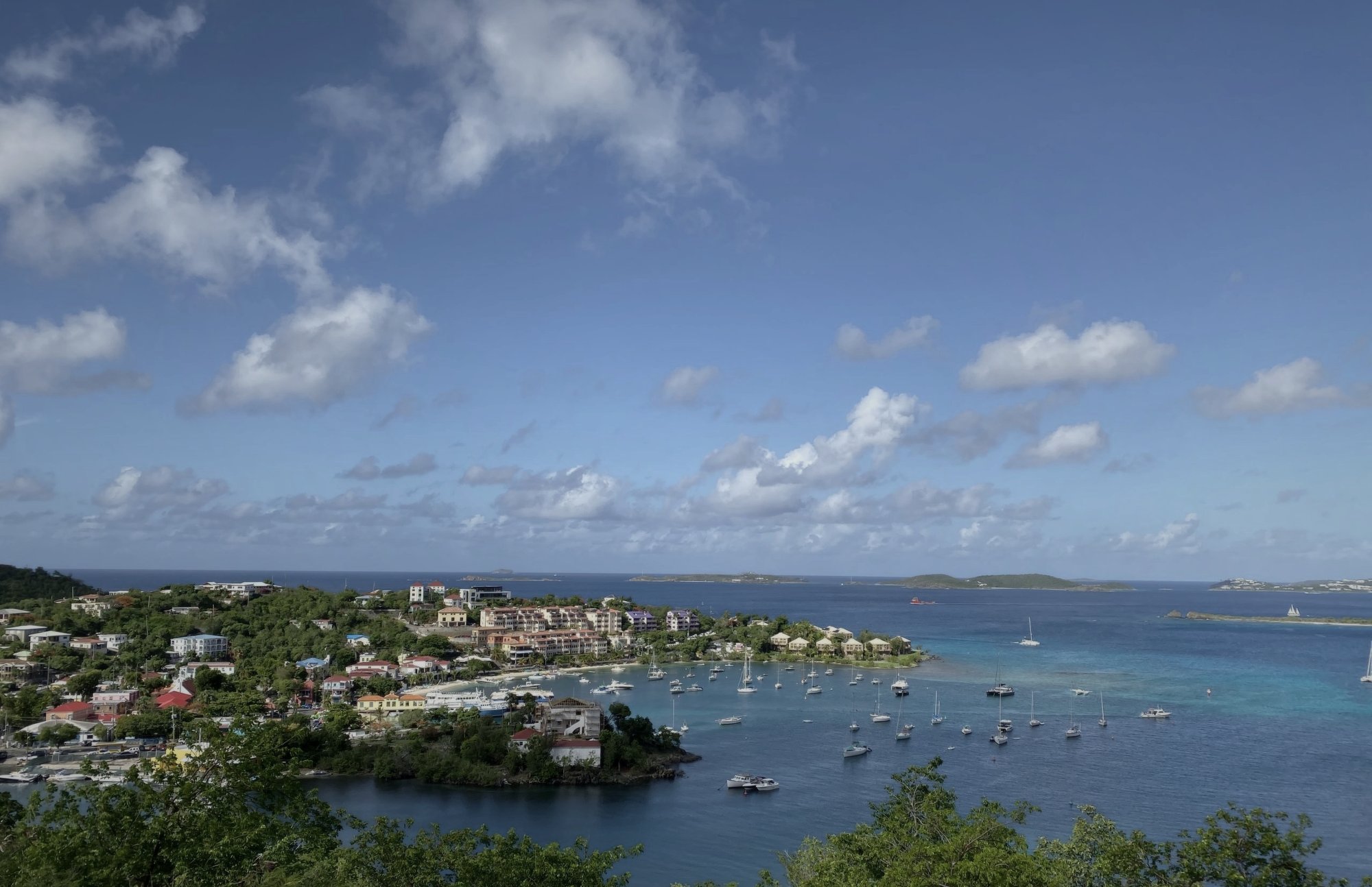 Elevated view over Cruz Bay harbor showing moored sailboats and town, St. John USVI