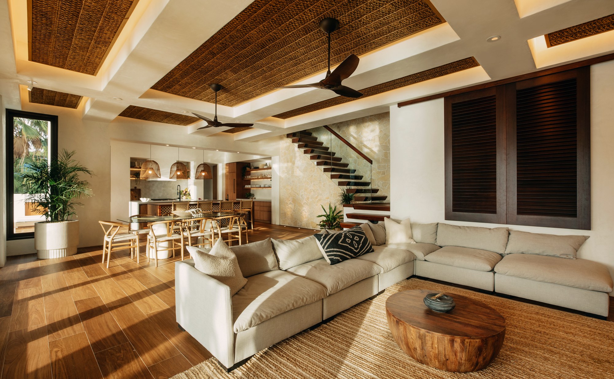 Indo House open-plan living area with sofa dining table and kitchen visible St. John USVI