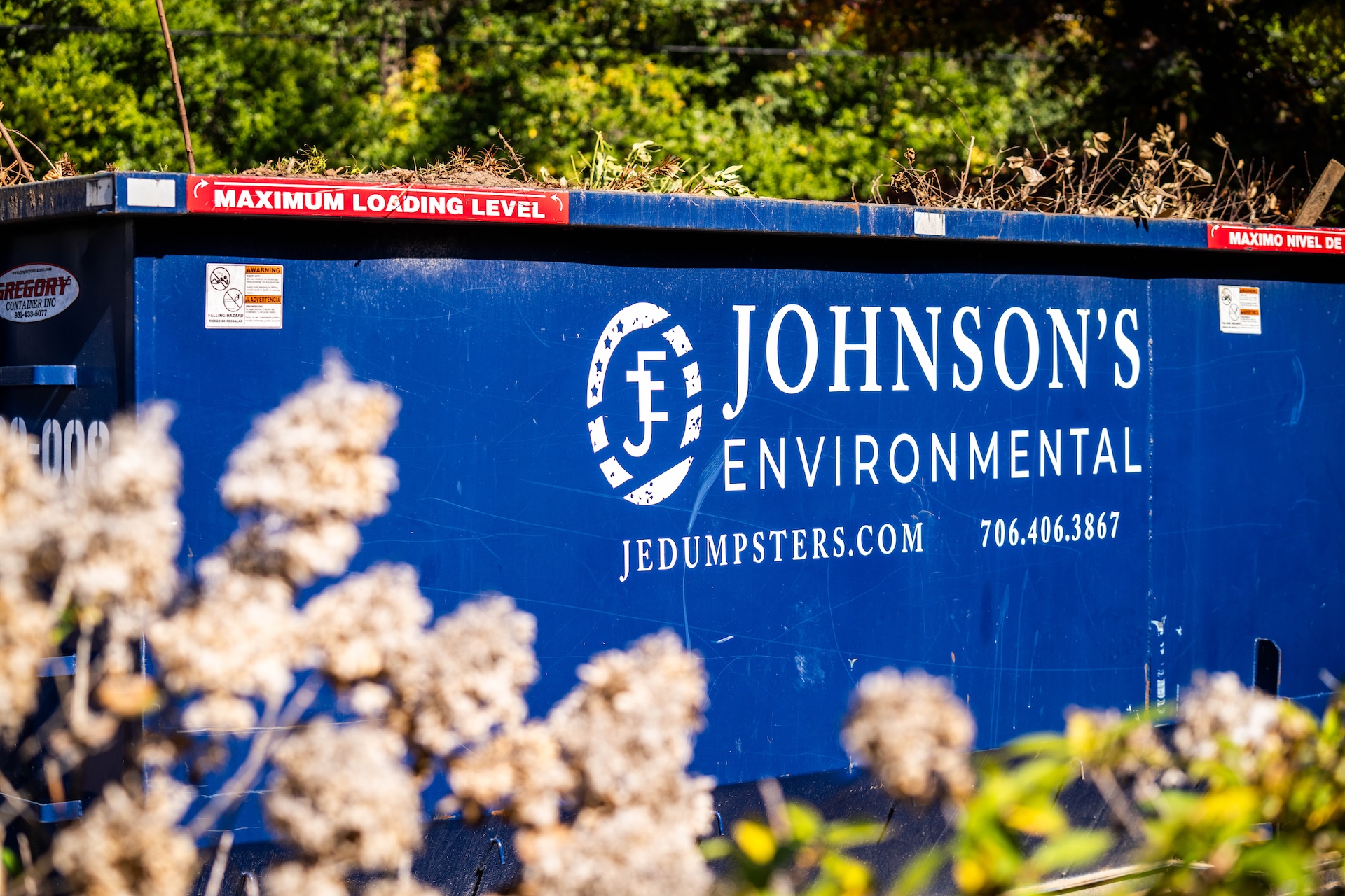 Johnson’s Environmental Dumpster Filled With Yard Debris