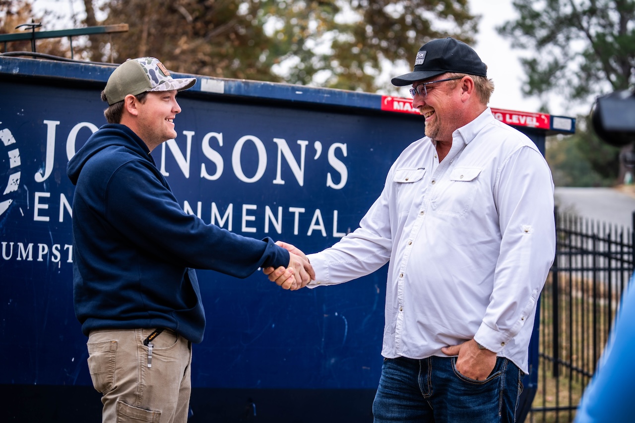 Johnson’s Environmental Team Member Greeting Dumpster Rental Customer
