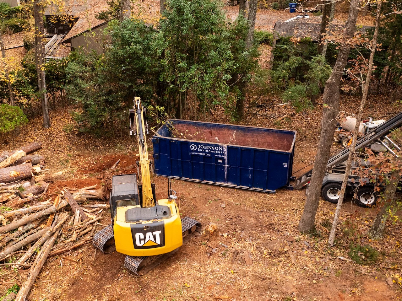 Aerial View Of Tree Removal Dumpster Site