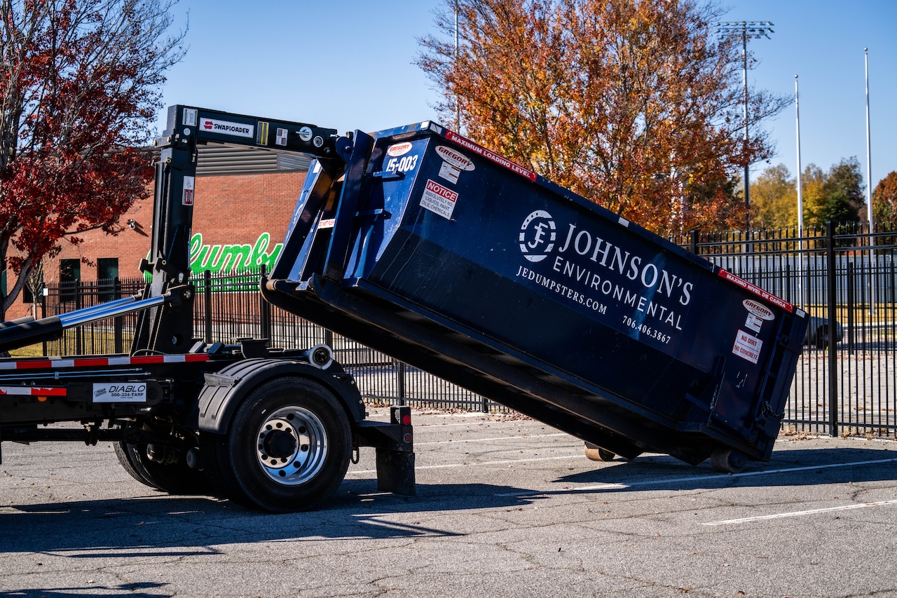 Johnson’s Environmental Truck Delivering 15 Yard Roll-Off Dumpster