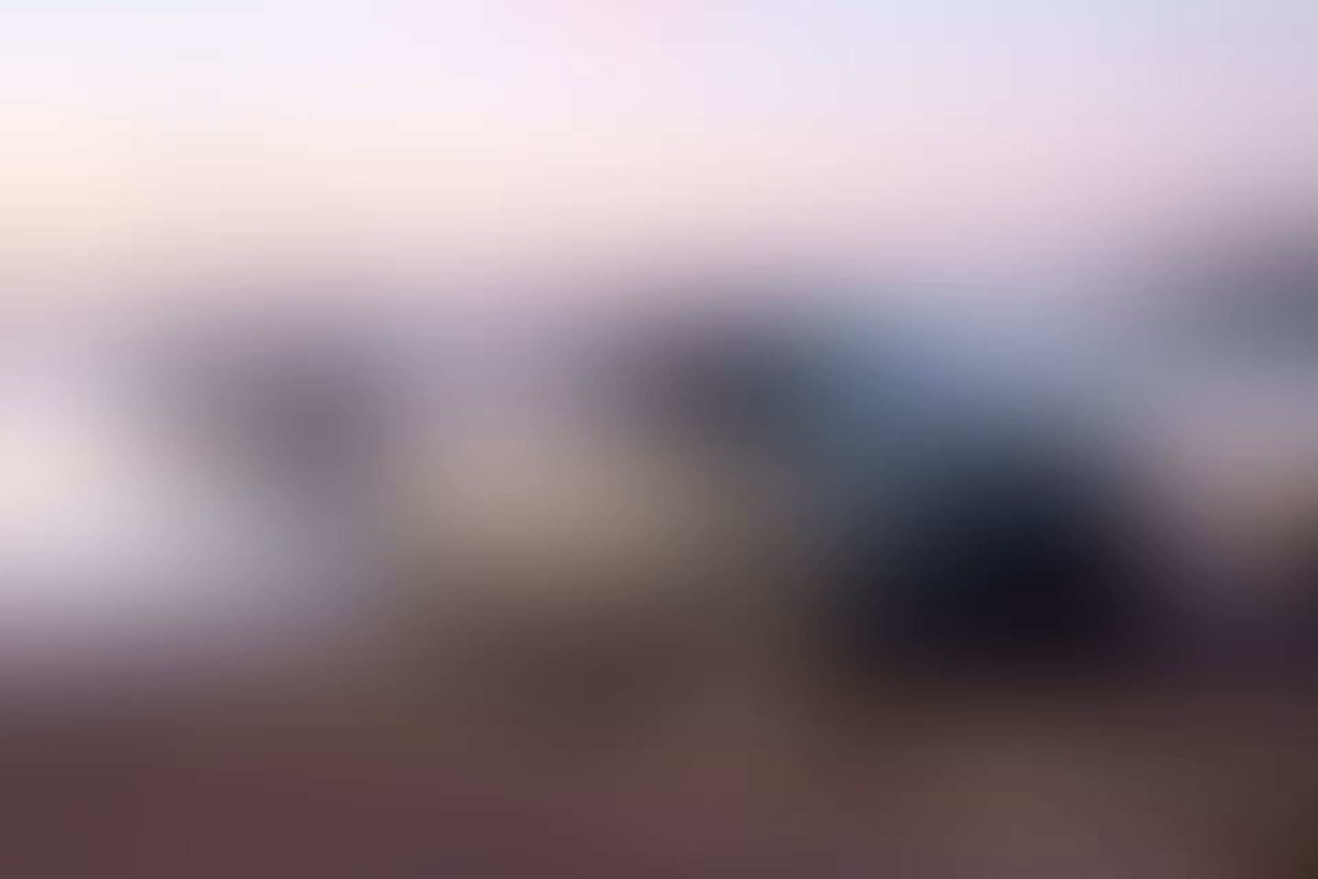Blurry background image of a car