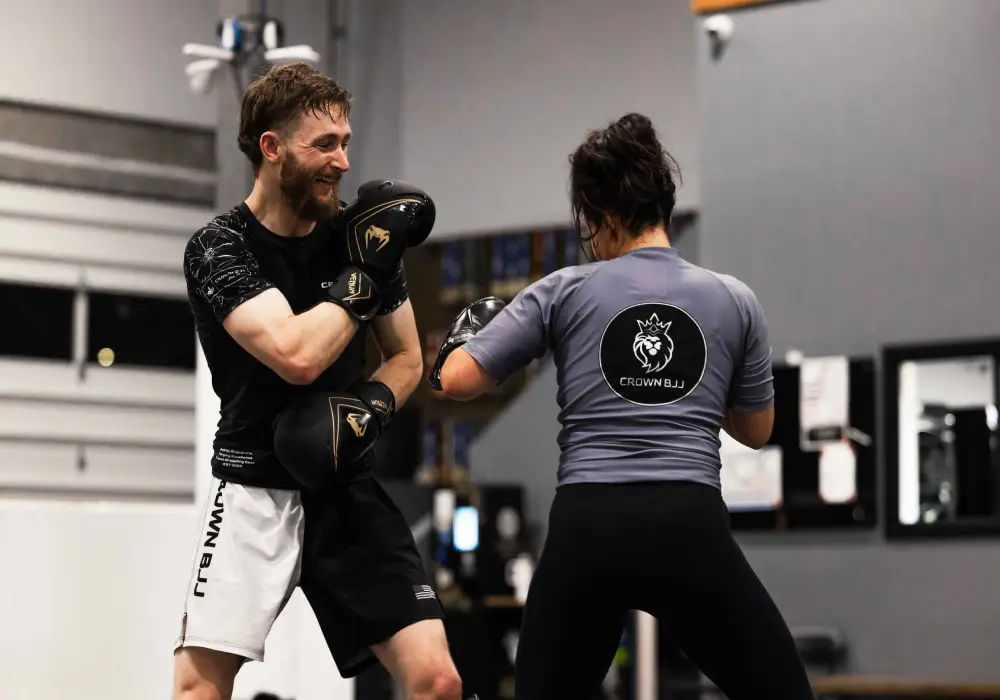 A Man and women practicing kickboxing