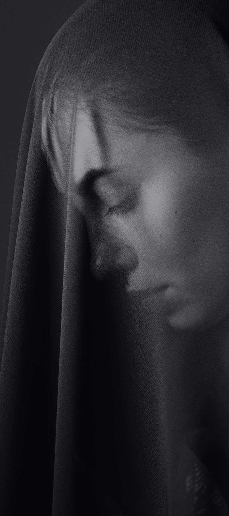 A beautiful woman in a transparent shawl.