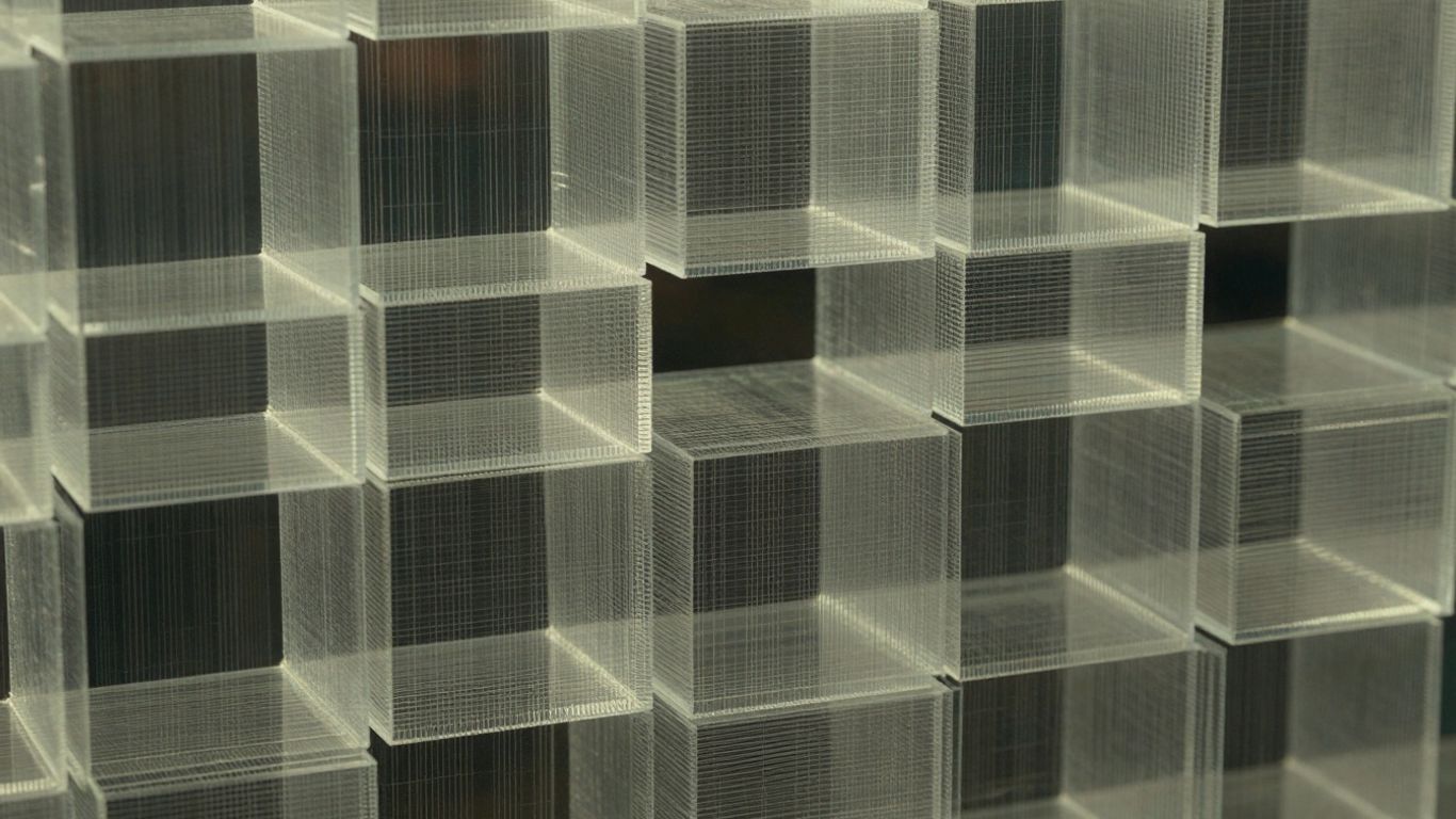 Layered data blocks with glowing grid pattern.