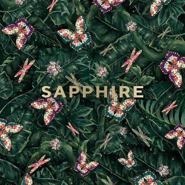 Artistic pattern of dark green tropical leaves with colorful butterflies and dragonflies surrounding the word 'SAPPHIRE' in beige text.