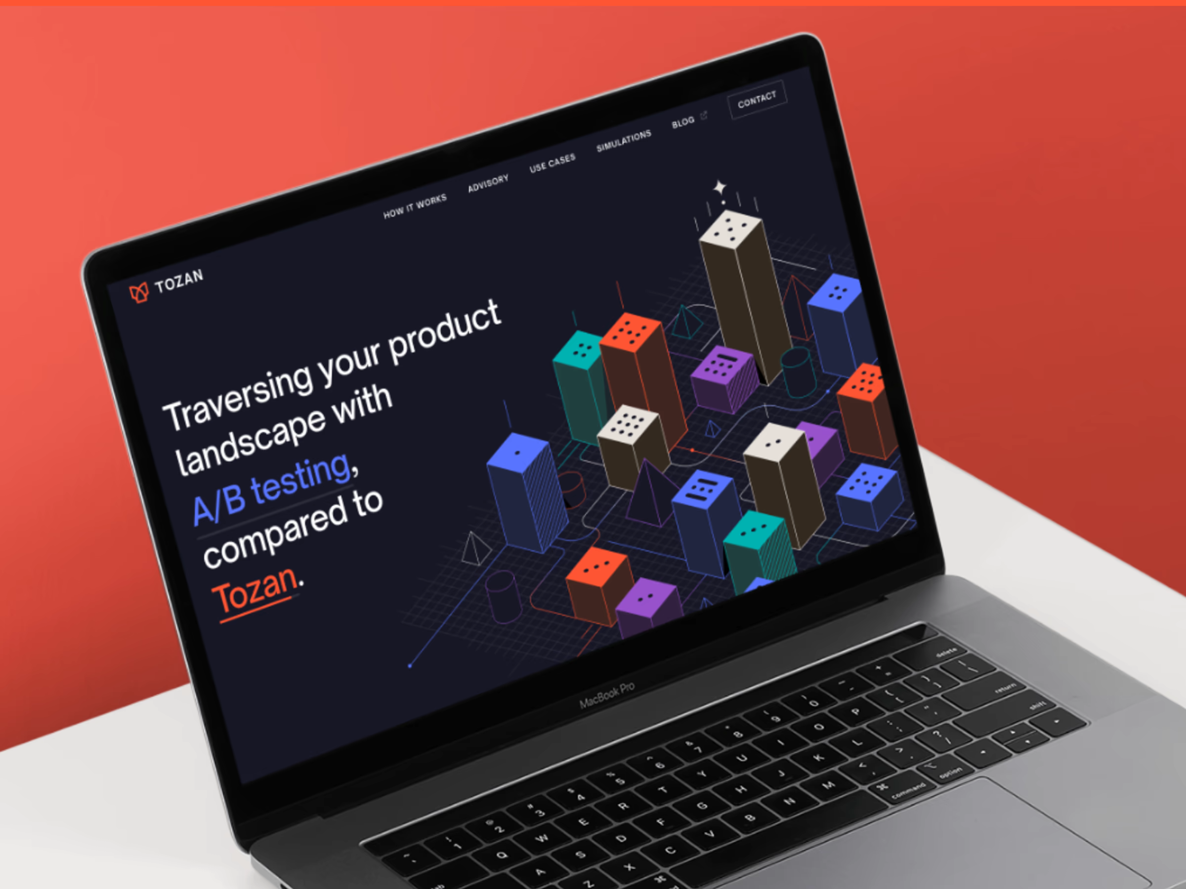 Laptop screen showing Tozan website with text about comparing A/B testing to Tozan and colorful dice-shaped 3D blocks graphic.