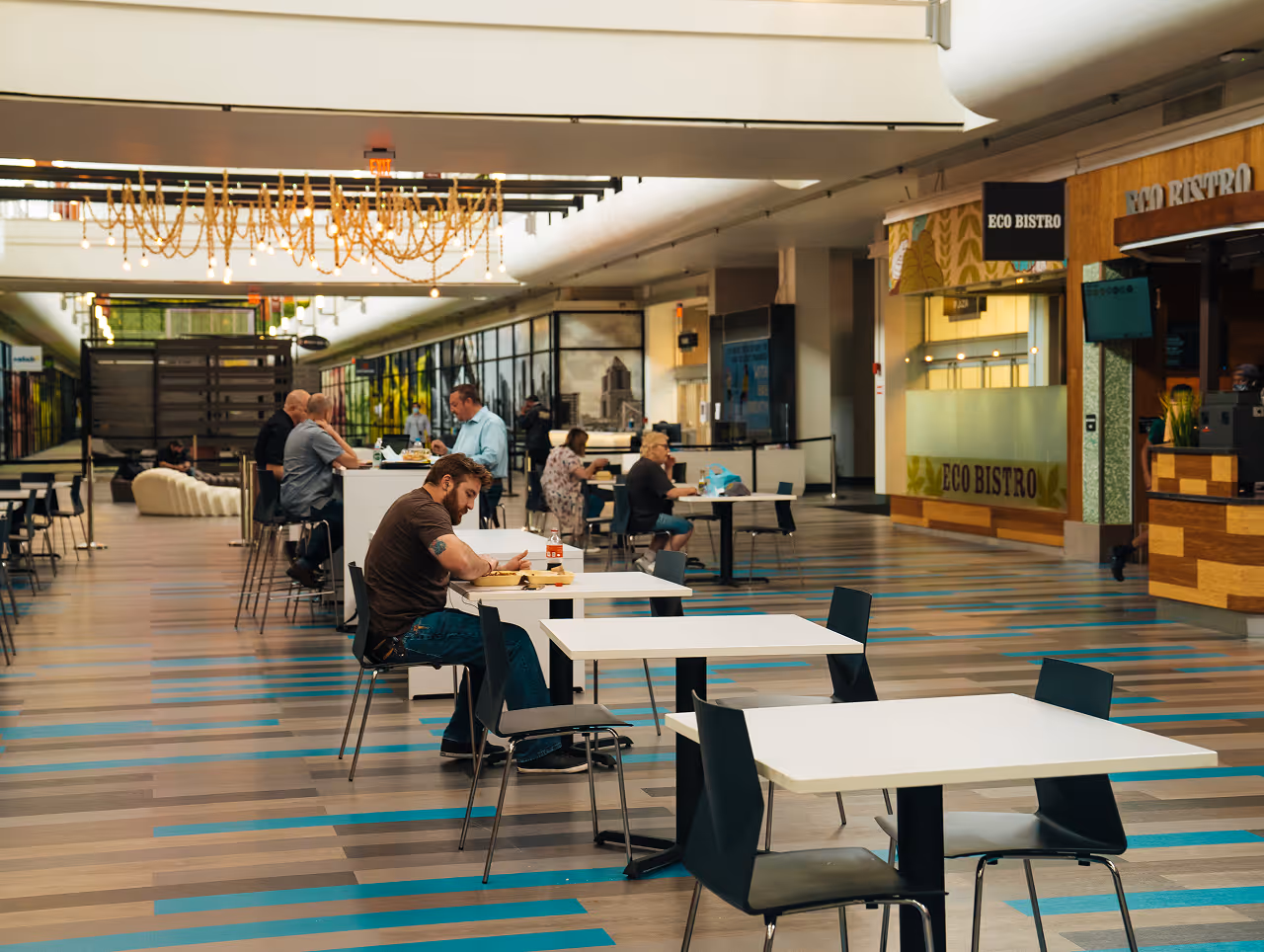 people working at communal tables at Nova Place