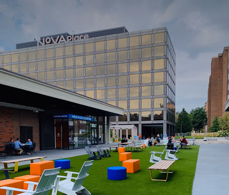 lawn chairs spread out on common green space on Nova Place campus