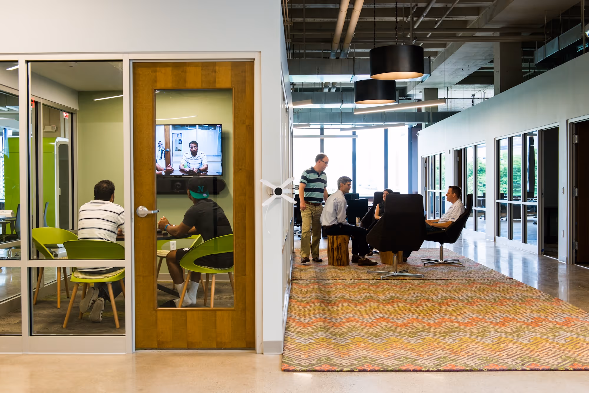 Image of people meeting in sitting areas.
