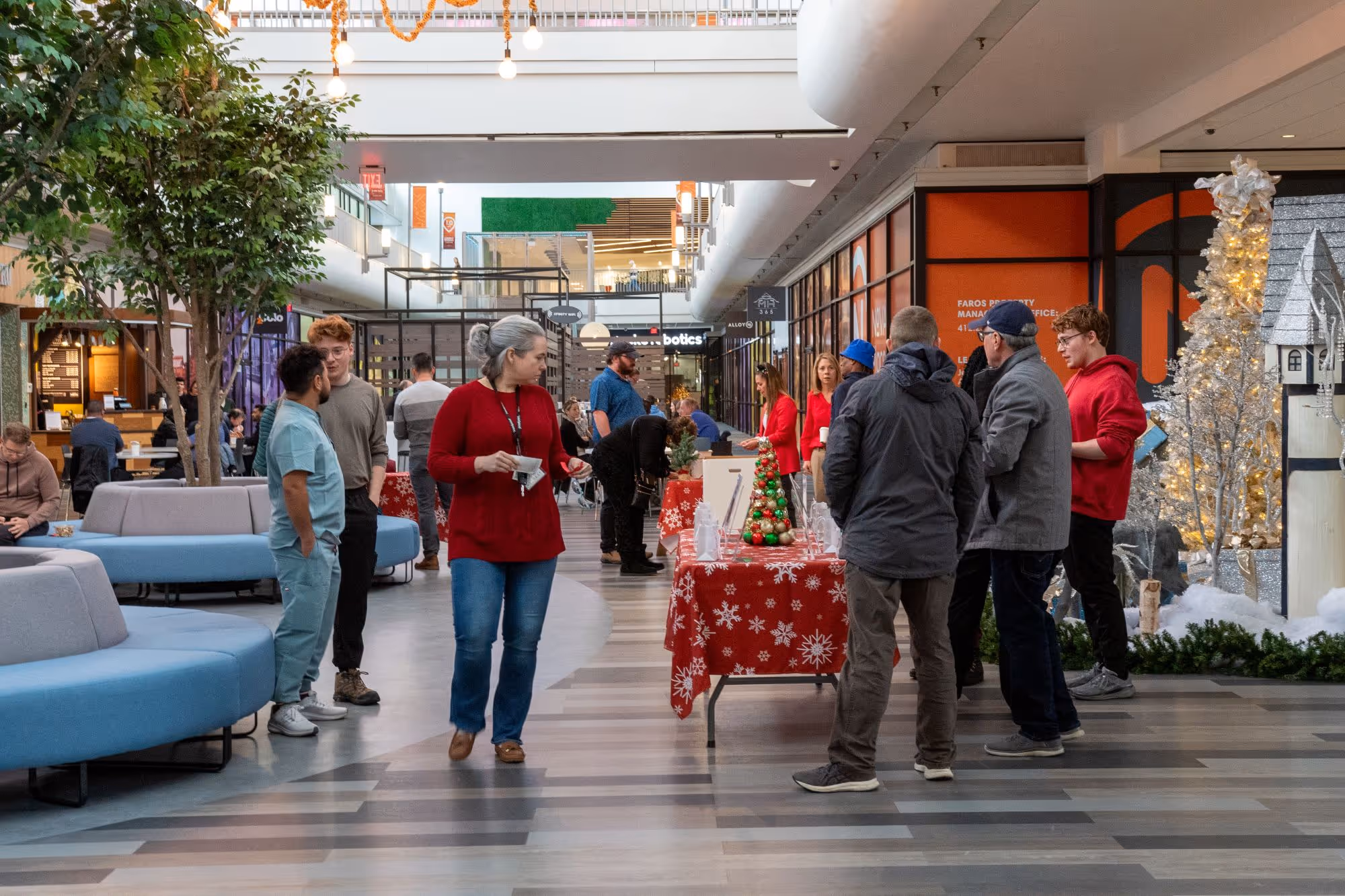 Image of the concourse fill with many people for an event.