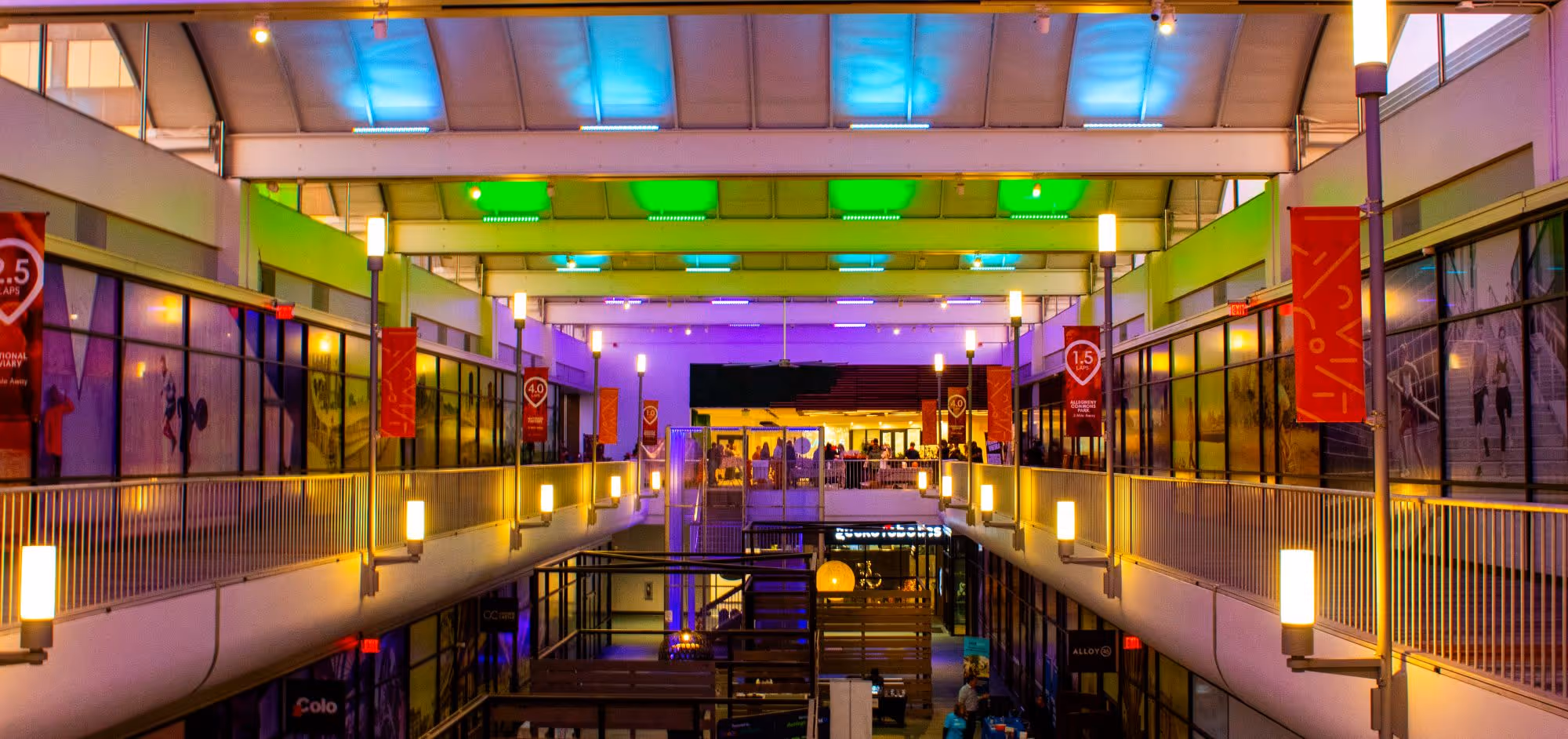 Image of the Concourse at Nova Place with colorful lighting.