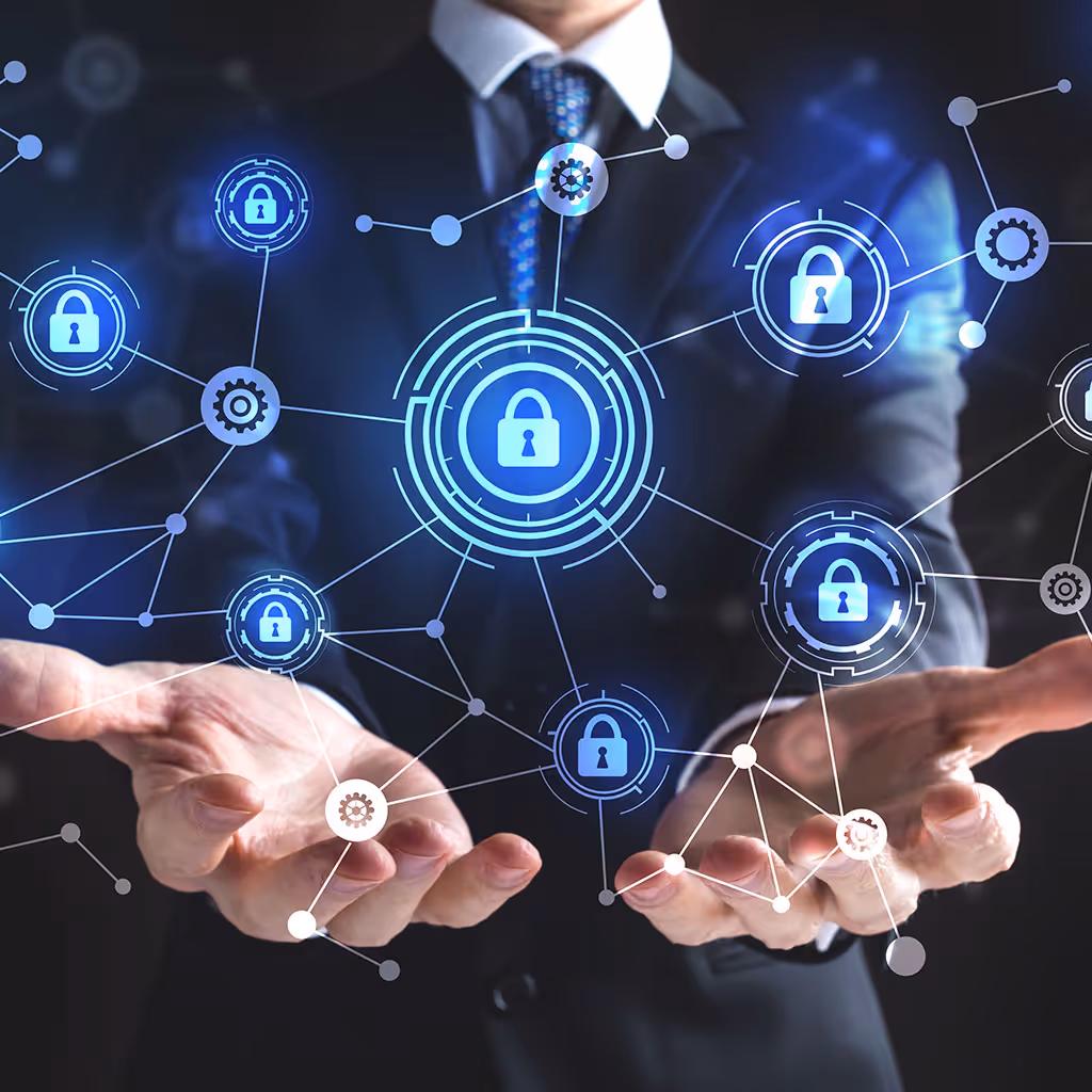 Businessman in suit holding virtual network with interconnected glowing lock and gear icons symbolizing cybersecurity.