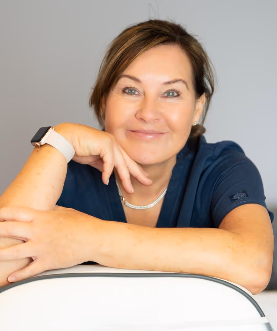 Donna Gibson leaning on a chair