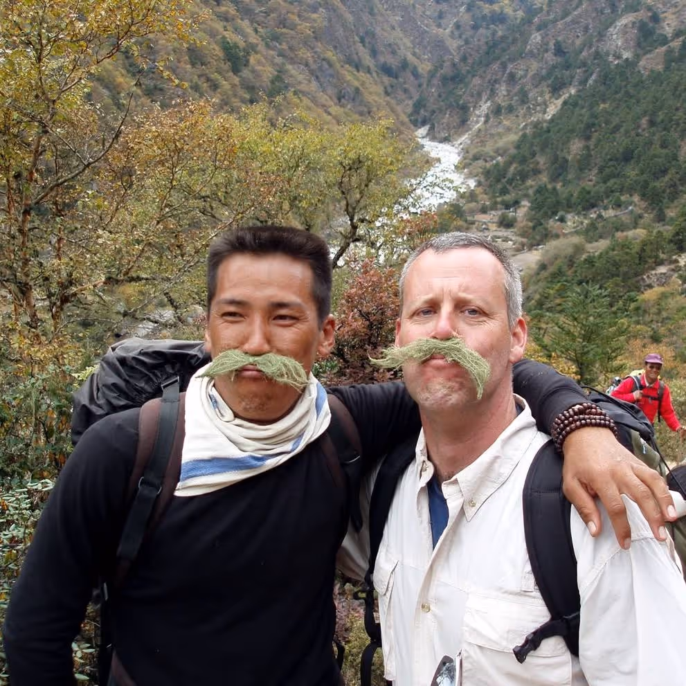 Ron Palmiter, Co-Founder of Enduring Legacy Mentors, hiking with a friend in Nepal