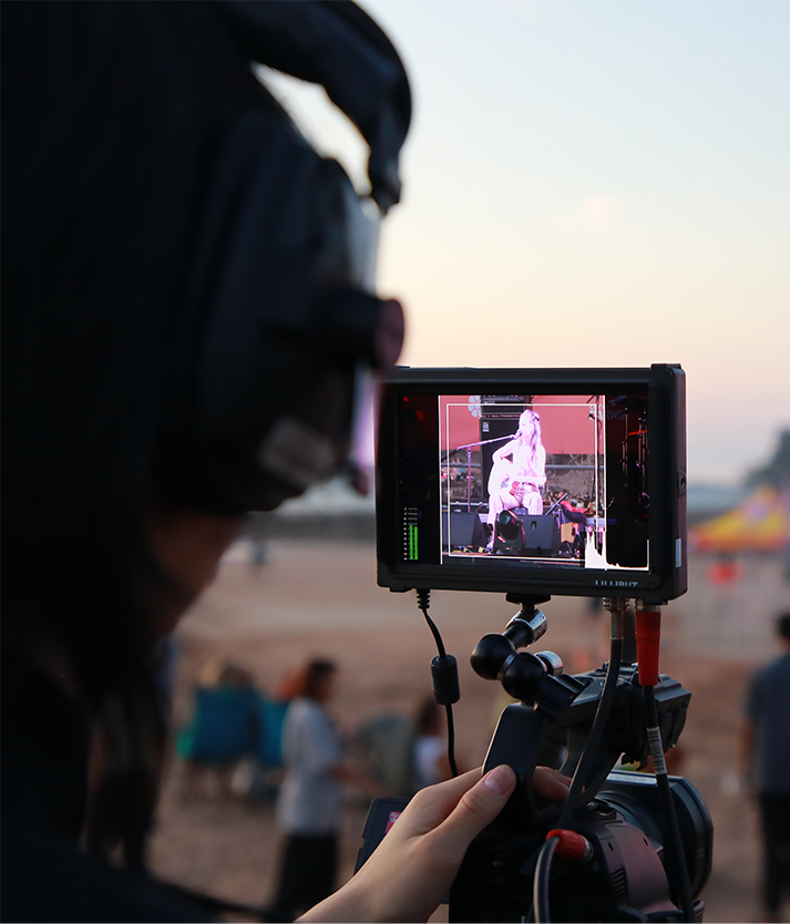 KIK EVENTS team operating live streaming equipment in Darwin, including cameras, vision switchers, and PA systems for weddings, funerals, and sports events.