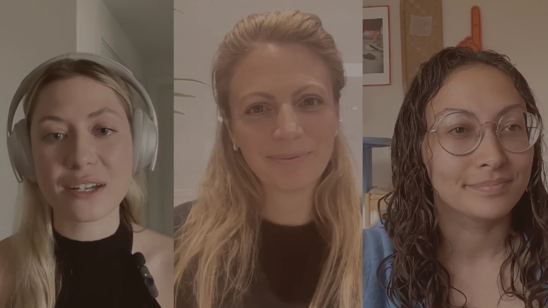 Three women in a video call, each in a separate vertical panel; the left woman wearing headphones and a black top, the middle woman with long blonde hair and a brown top, and the right woman with curly hair, glasses, and a blue top.