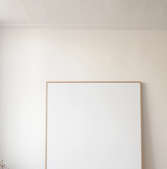 Mirror beside a wall