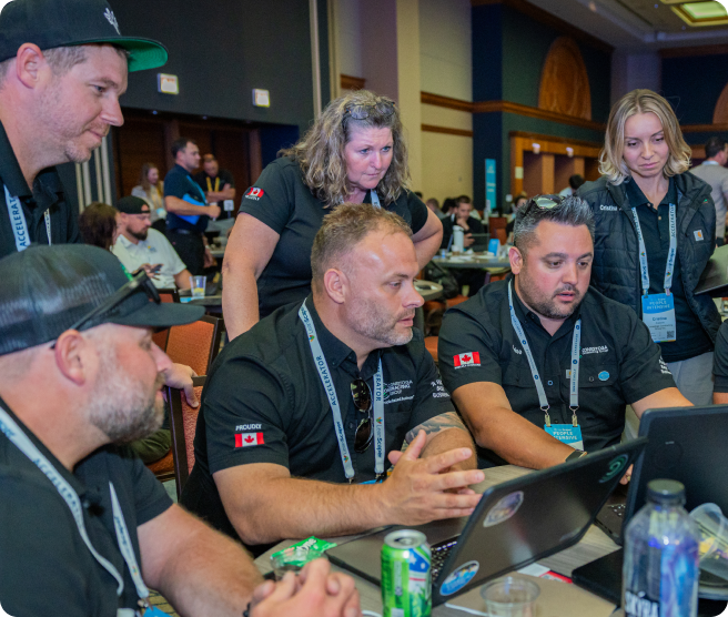 Landscaping business leadership team reviewing new software together at a computer