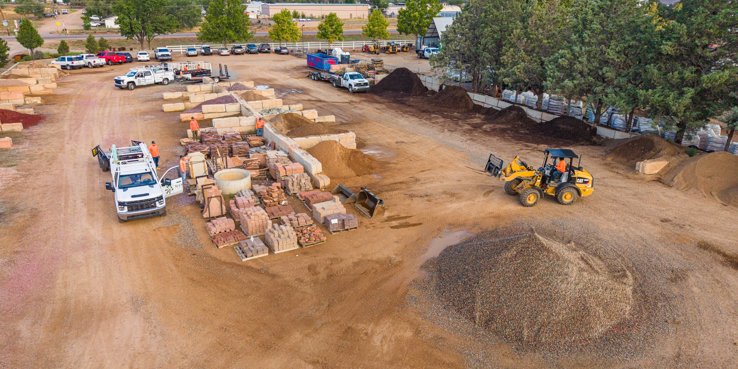Aerial view of the yard, material piles and loader