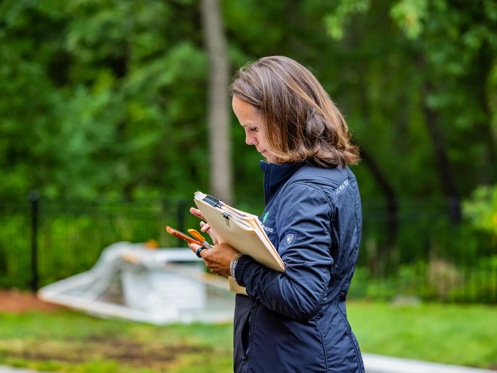 Nicole Downer taking notes during a site visit