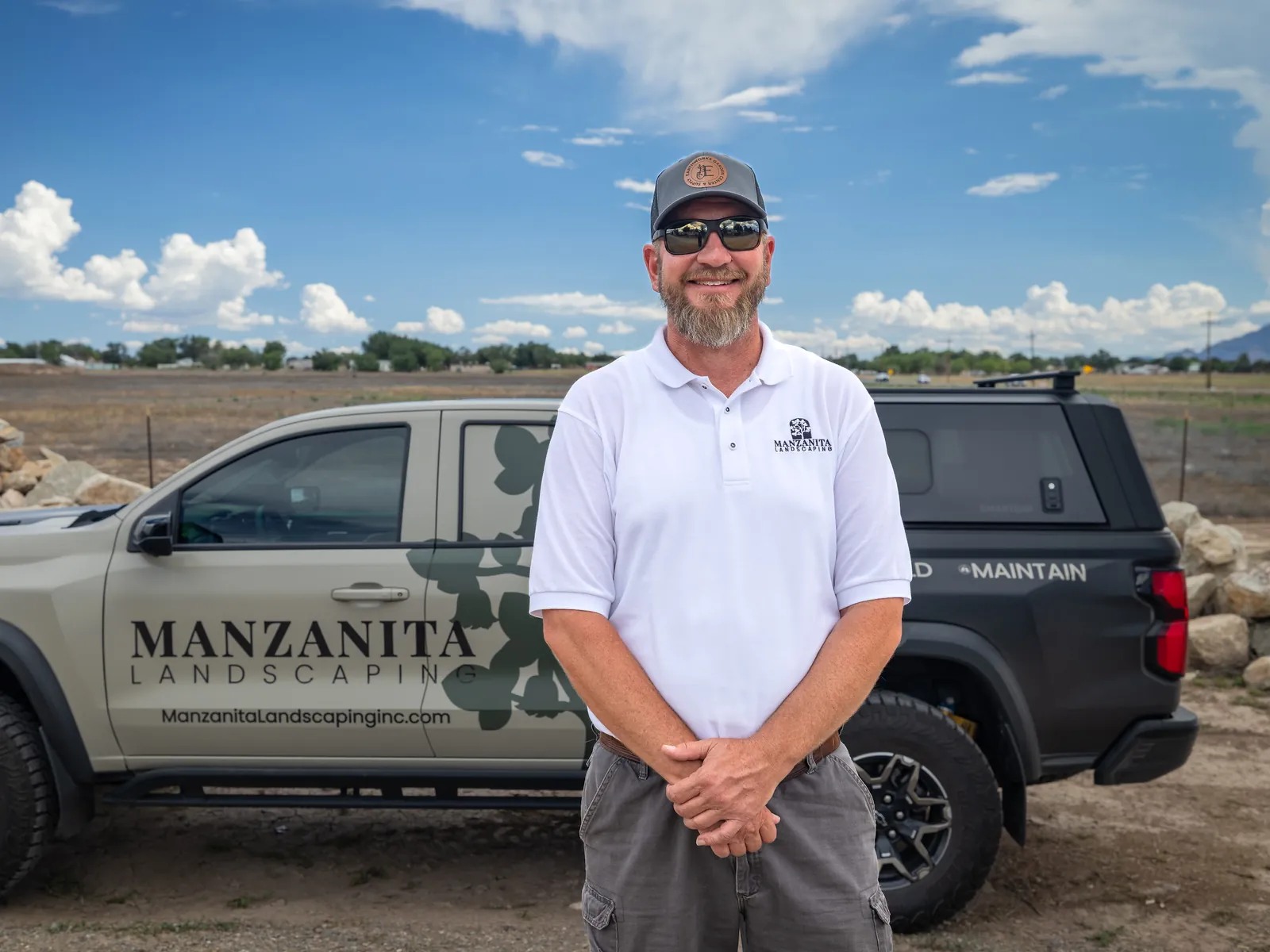 Marc Vetere standing beside a Manzanita Landscaping truck