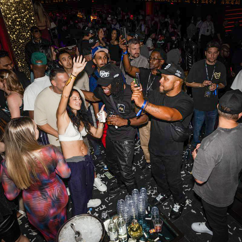 Photo from DDNYC in NYC where the Doginal Dogs community celebrated with friends at a big party, showing off exclusive Doge-inspired merch, inscriptions/NFTs, and the creativity of Dogecoin and Doginals.