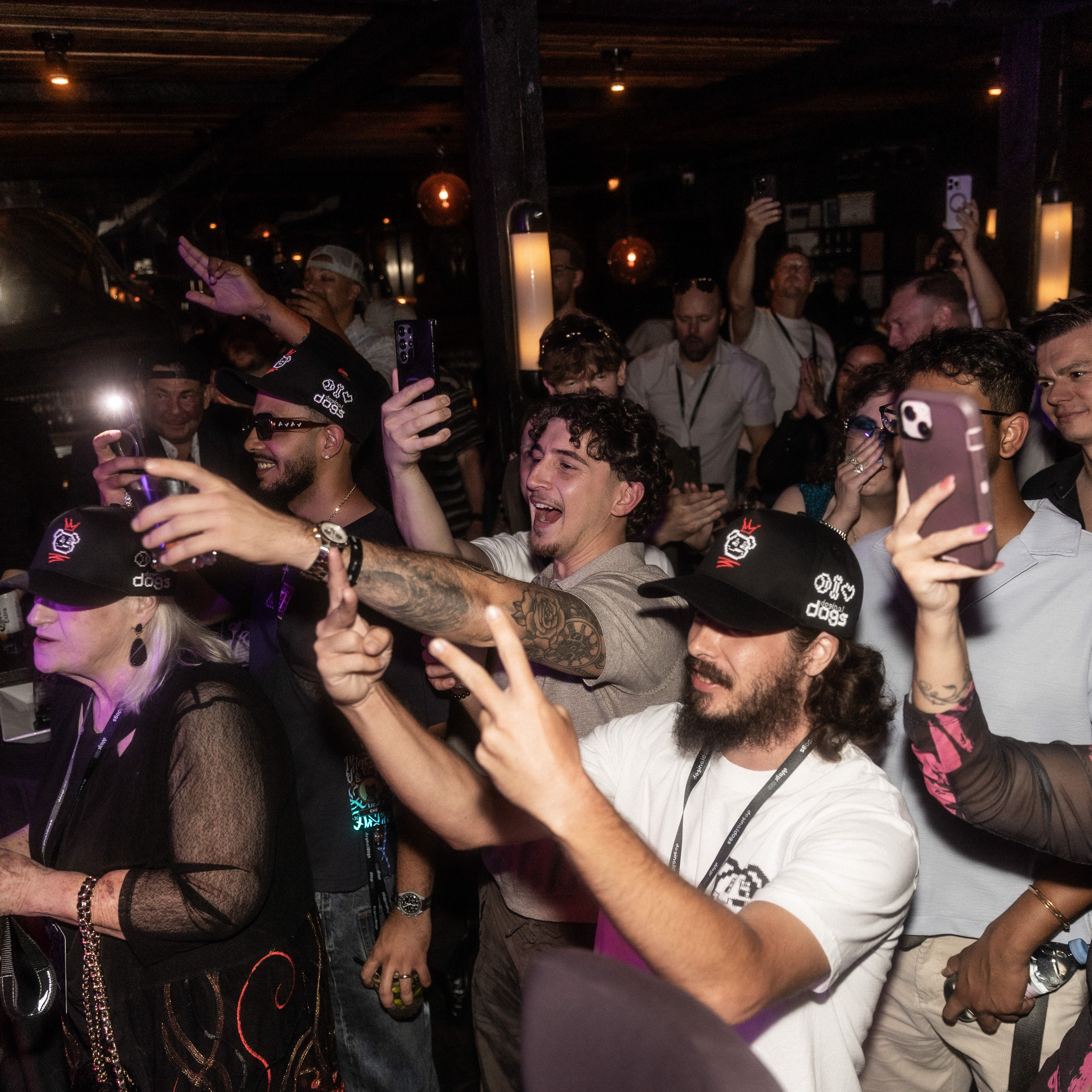 Photo from DDNYC in NYC where the Doginal Dogs community celebrated with friends at a big party, showing off exclusive Doge-inspired merch, inscriptions/NFTs, and the creativity of Dogecoin and Doginals.