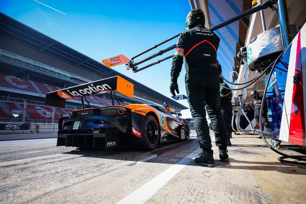 McLaren race team working in the pit lane