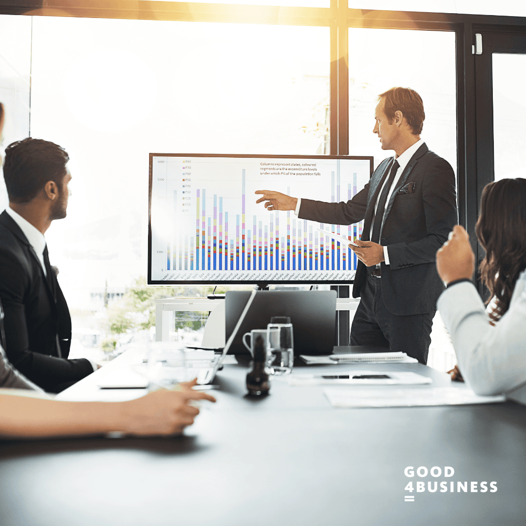 Man explaining graph to male and female