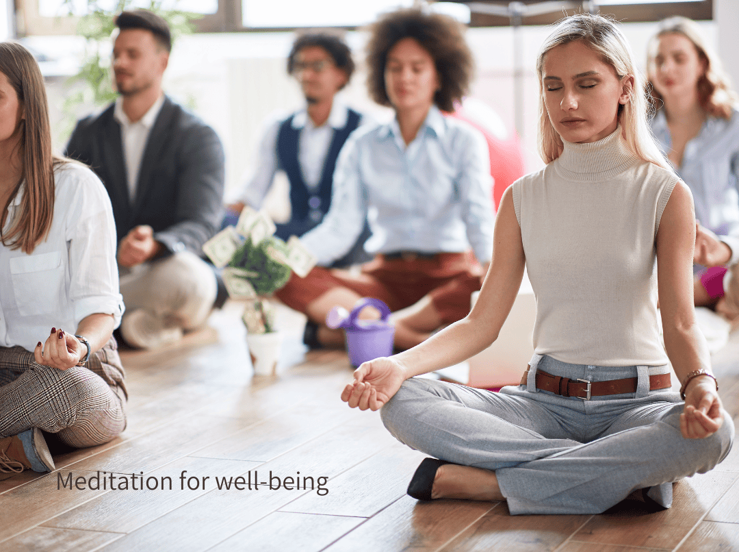Group of office workers sitting on floor meditating in lotus pose