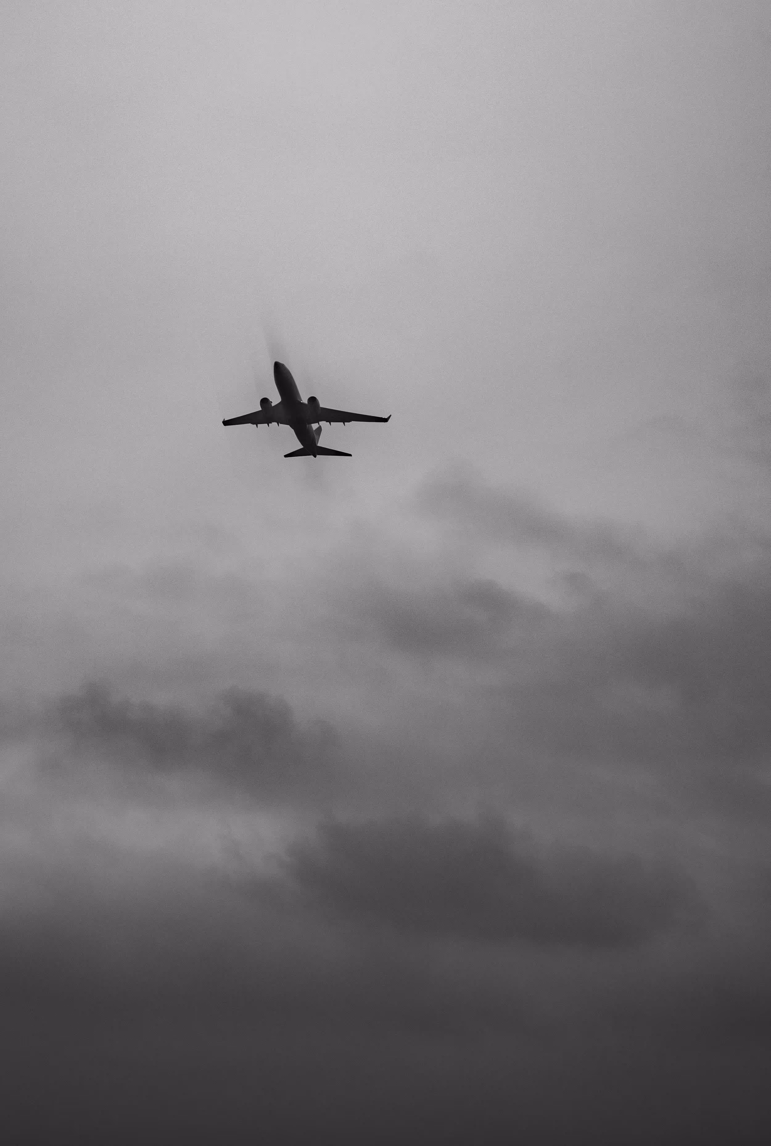 Airport under cloudy skies, representing the impact of climate change on global aviation.
