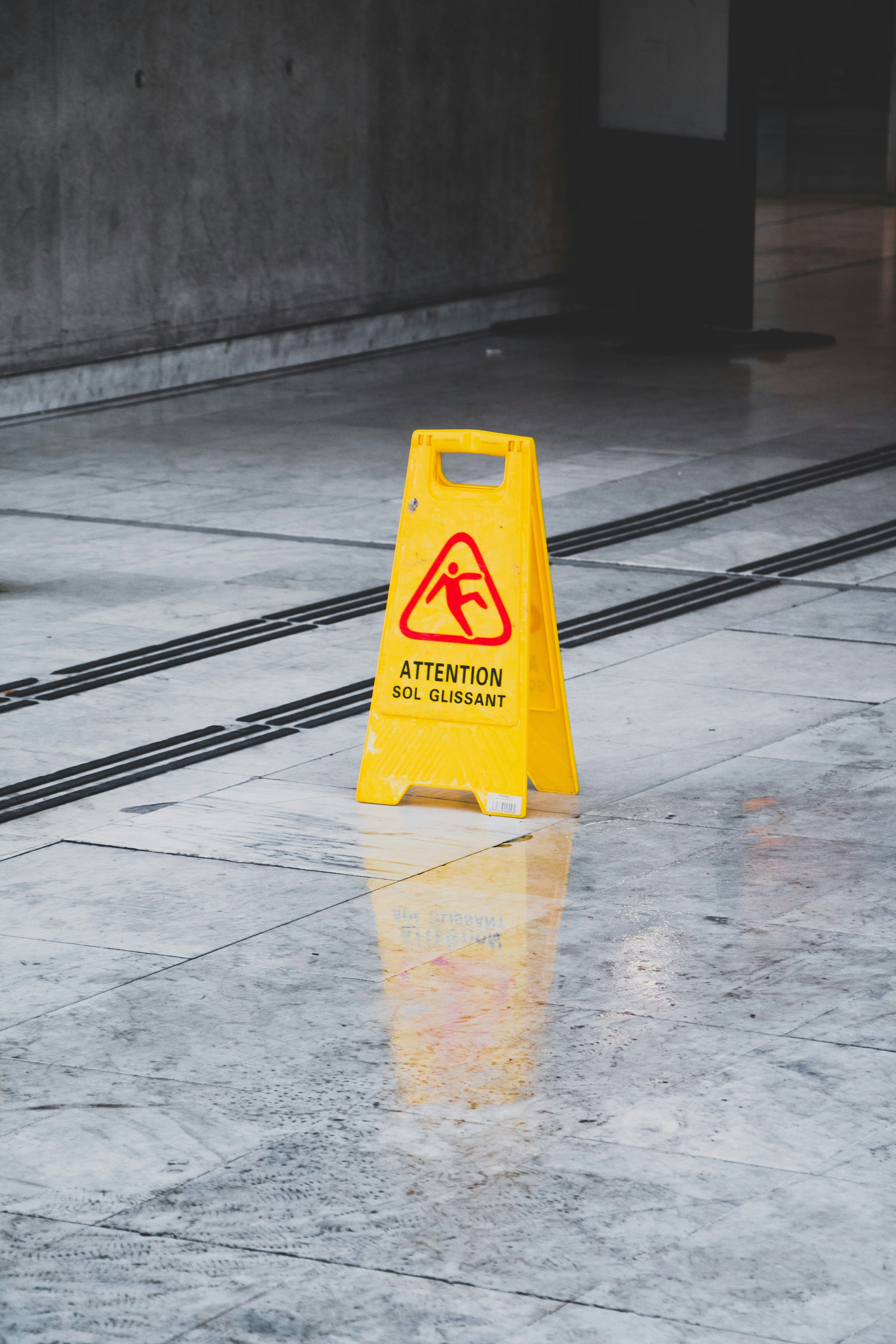 Caution wet floor sign symbolising awareness and safety.