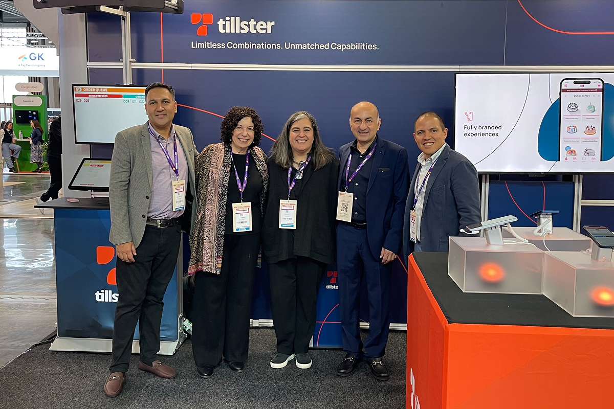 Team members posing at the Tillster booth during a restaurant technology trade show.