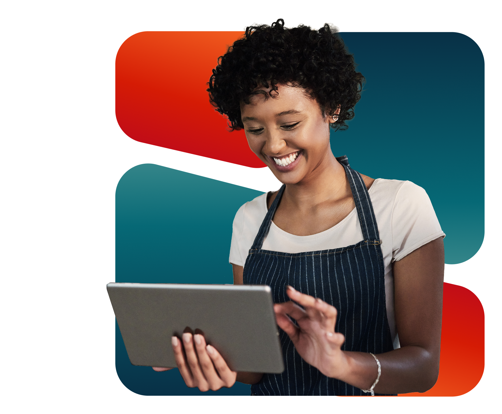 Smiling restaurant employee wearing a striped apron using a digital tablet.