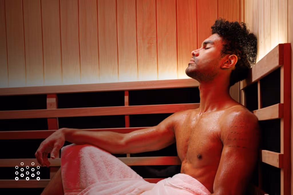 Man relaxing in private infrared sauna suite