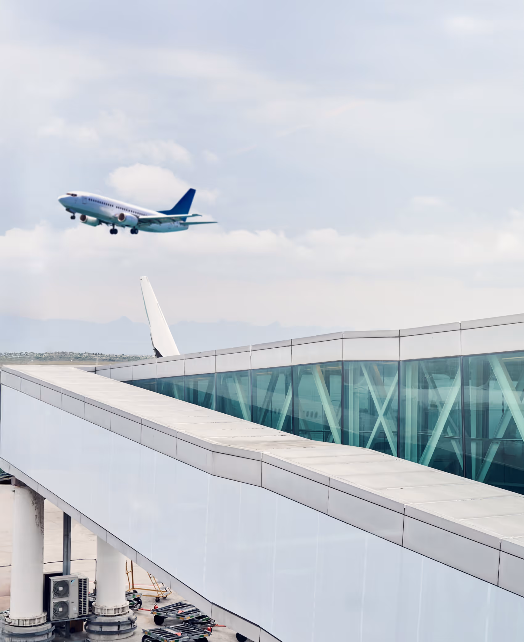 Commercial aircraft at an airport gate, representing airline operations managed by Orbit