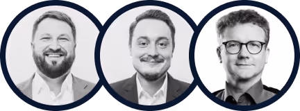 Black and white portrait photos of three men in circular frames, all smiling and dressed in formal attire.