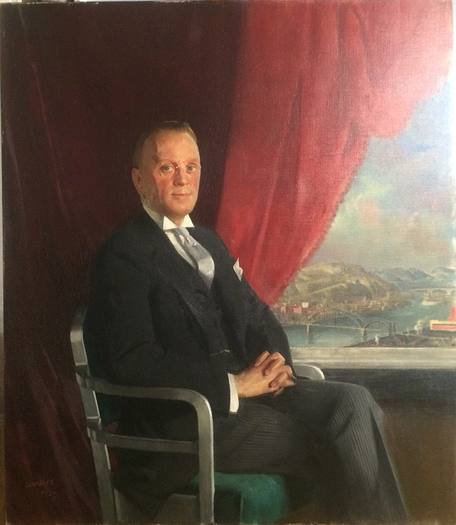 Portrait of a man in a dark suit seated on a chair with a red curtain and scenic landscape with bridges in the background.