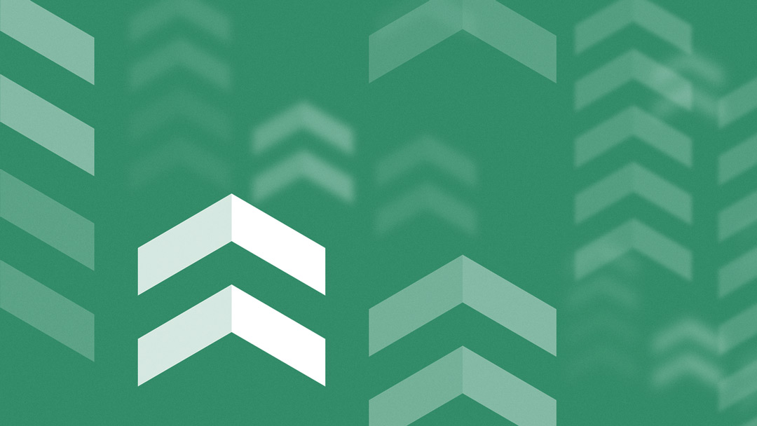 Pattern of layered upward-pointing chevron shapes in various shades of green.