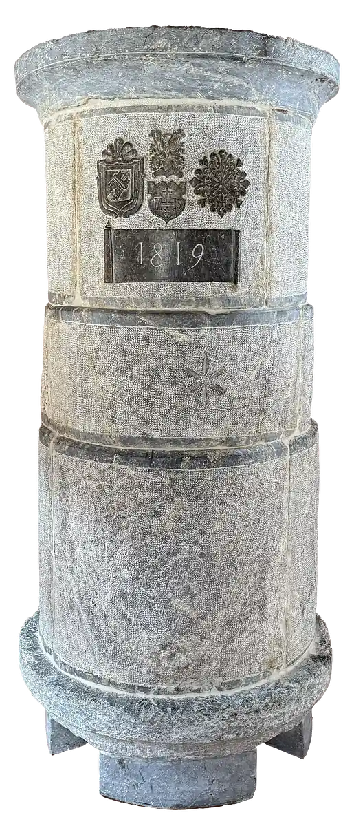 Stone pillar carved with three heraldic crests and dated 1819