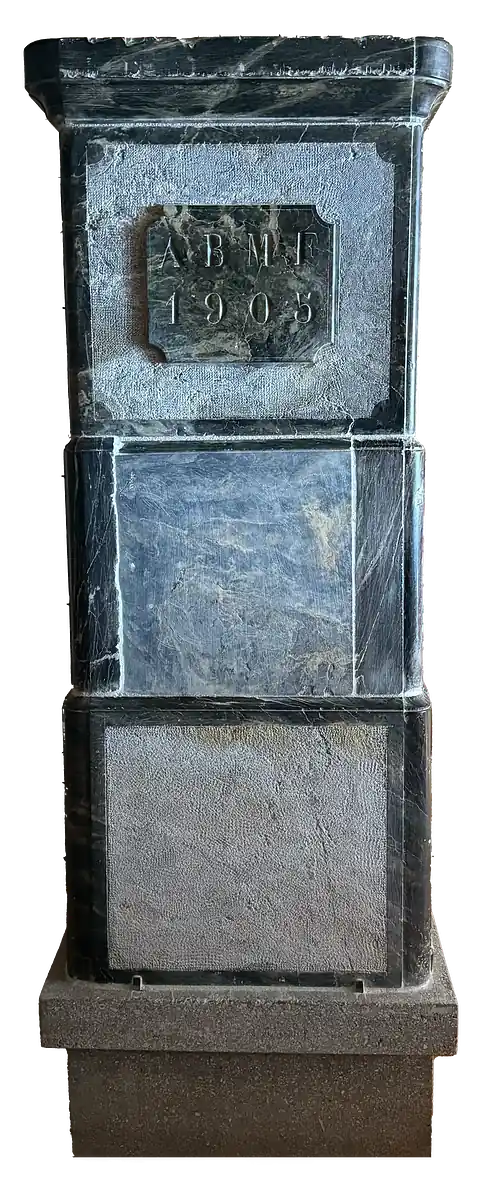 Marble pillar with an engraved plaque dated 1905