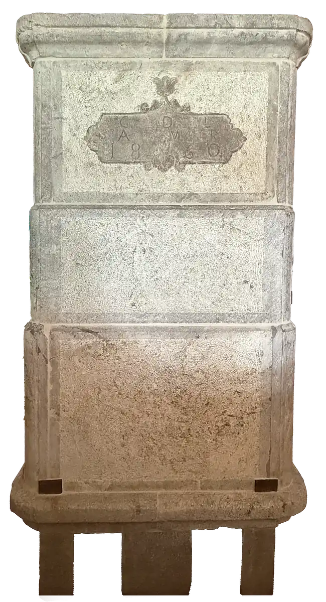 Carved stone pillar with an engraved plaque dated 1860