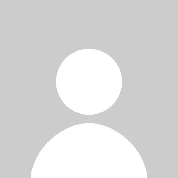 Generic user profile icon with a white circle for the head and a larger white semicircle for the shoulders on a gray background.