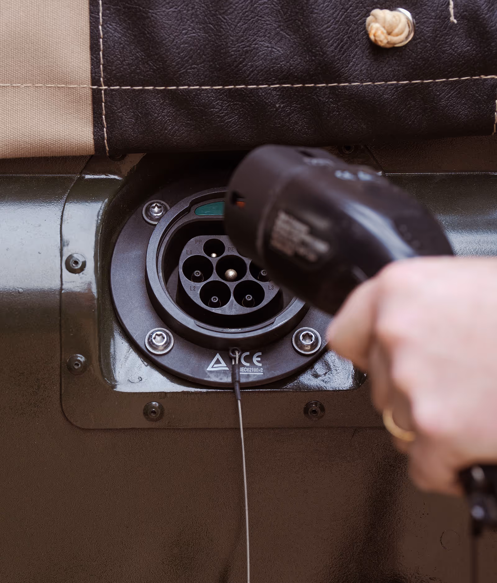 Electric vehicle charging port with plug being connected