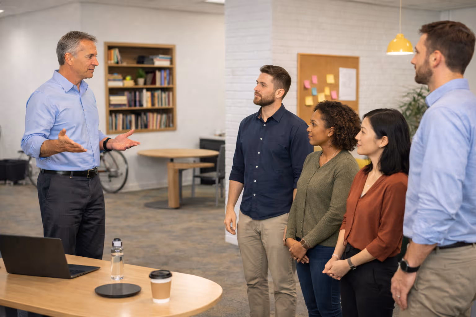 Employer and HR team implementing a workplace wellness program to reduce sedentary behavior and prolonged sitting
