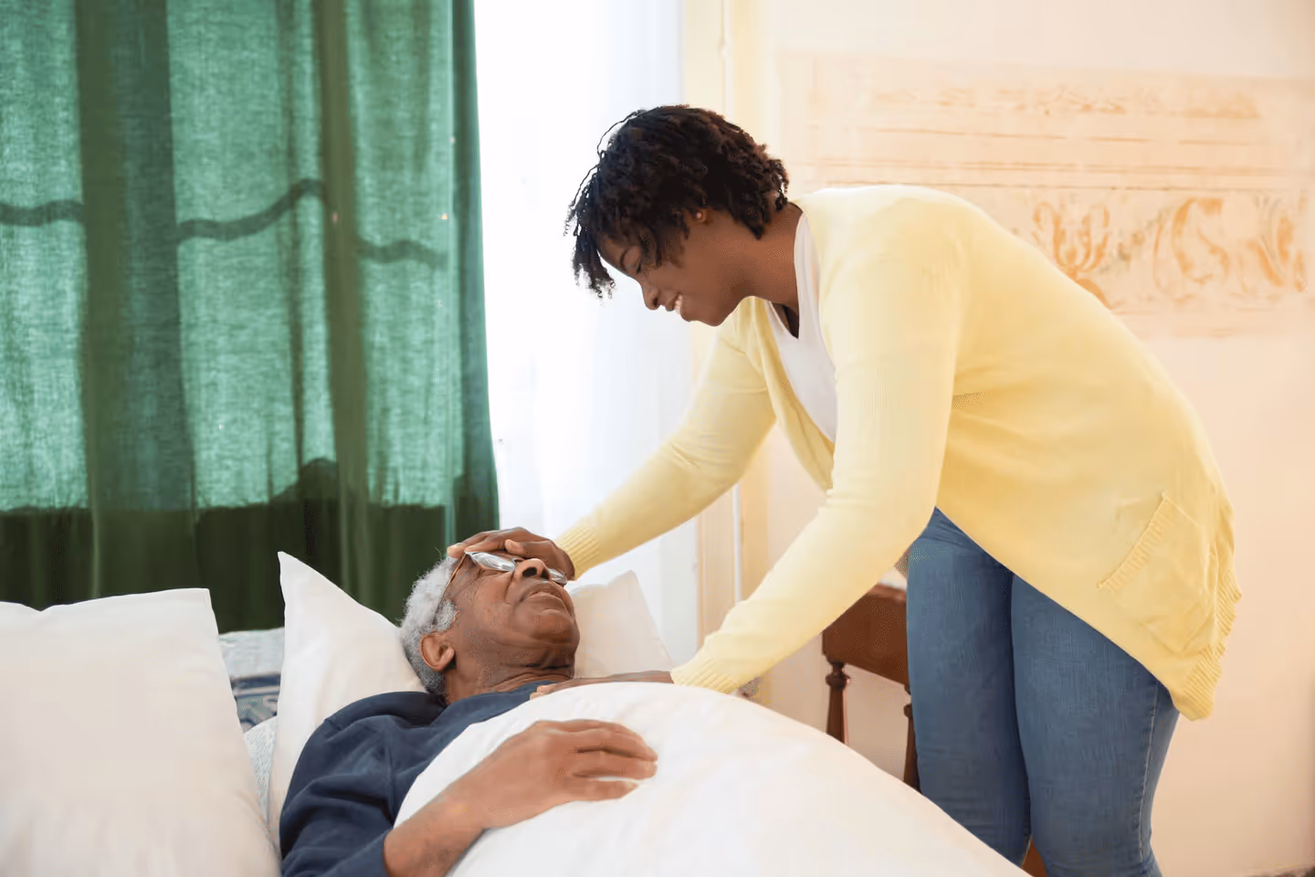 A caregiver and a young child engaging together at home during a care visit