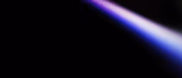 A streak of blue and purple light against a black background.